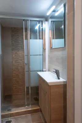 a bathroom with a sink and a shower at Blue Ark Stylish Athens in Athens