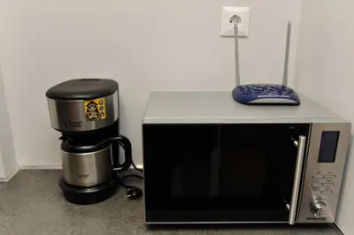 a coffee maker and a microwave with a coffee pot at Athens heart, Syntagma metro studio in Athens