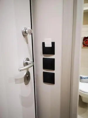 a door to a bathroom with a toilet at Syntagma Square Athenian apartments in Athens