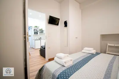 a bedroom with a bed with towels on it at Syntagma Square Athenian apartments in Athens