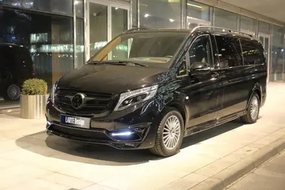 a black van parked in front of a building at Mc Queen Rooms & Apartments in Athens