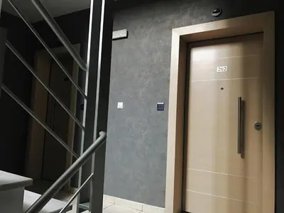 a elevator door in a building with the number db at Mc Queen Rooms & Apartments in Athens