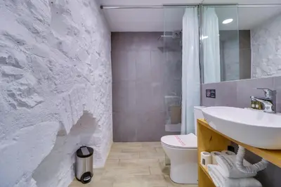 a bathroom with a sink and a toilet at athensotel in Athens