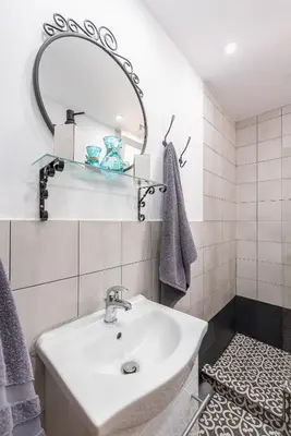a bathroom with a sink and a mirror at Athenz Downtown Studio in Athens