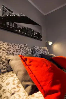 a bedroom with a bed with pillows on it at Romeo & Juliet -Modern & Stylish Apartment With City View in Egaleo-Athens in Athens