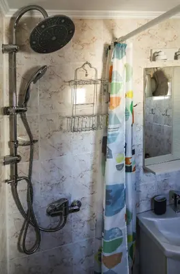 a shower with a shower curtain in a bathroom at Romeo & Juliet -Modern & Stylish Apartment With City View in Egaleo-Athens in Athens