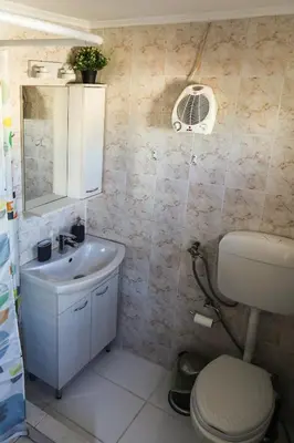 a bathroom with a white toilet and a sink at Romeo & Juliet -Modern & Stylish Apartment With City View in Egaleo-Athens in Athens