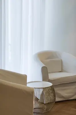 a living room with a couch and a coffee table at The Parliament Studio in Athens