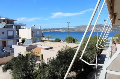 a view of a body of water from a building at Apartment SEA VIEW in front of the beach of Agia Marina in Porto Rafti