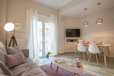 a living room with a couch and a table at 