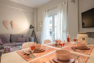 a dining room with a table with plates and wine glasses at 