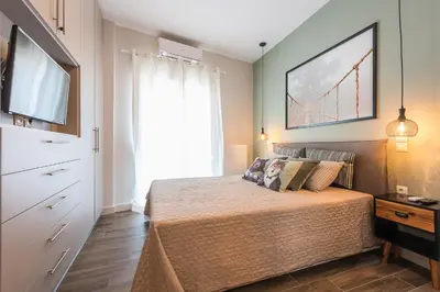 a bedroom with a bed and a large window at 