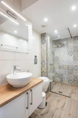 a white bathroom with a sink and a toilet at Boutique Studios near Airport in Pallíni