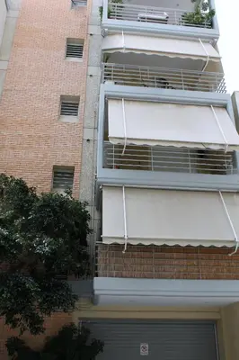 a building with an air conditioner on the side of it at Cozy studio apartment in PIREUS in Piraeus