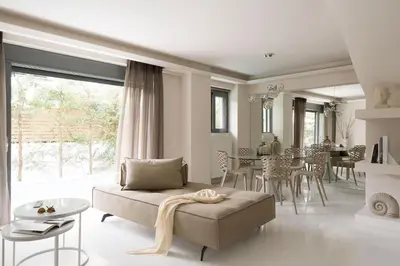 a living room with a couch and a table at Grystal Green Properites in Athens