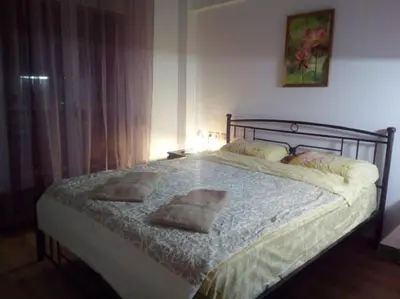 a bedroom with a bed with two pillows on it at Comfortable inexpensive apartmets near metro in Athens