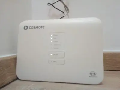 a white laptop computer sitting on top of a table at Comfortable inexpensive apartmets near metro in Athens
