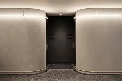 a hallway with two metal doors in a building at Perianth Hotel, a Member of Design Hotels in Athens