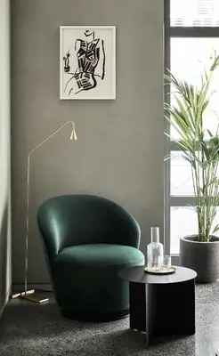 a green chair in a living room with a table at Perianth Hotel, a Member of Design Hotels in Athens