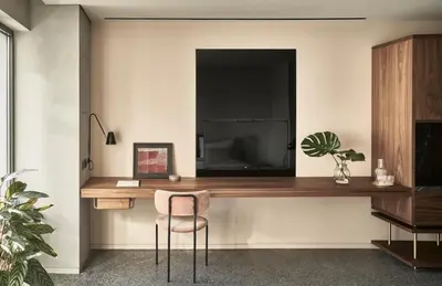 a room with a desk with a television and a chair at Perianth Hotel, a Member of Design Hotels in Athens