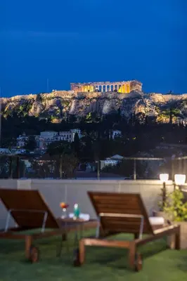 a view of a castle on top of a mountain at The Athens Version Luxury Suites in Athens