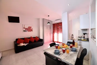 a living room with a table and a couch at Central Athens Studios in Athens