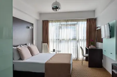 a hotel room with a bed and a window at Breeze Boutique Athens by Prima Hotels in Athens