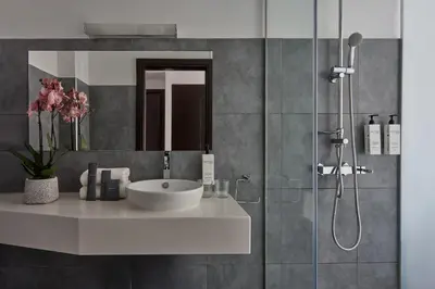 a bathroom with a sink and a shower at Breeze Boutique Athens by Prima Hotels in Athens