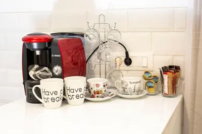 a kitchen counter with coffee mugs with the words have no regrets at Raise cosy apartment in Athens