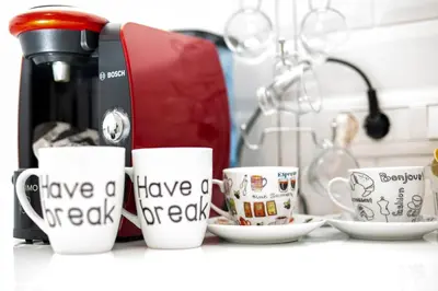 a group of coffee mugs that say have a have a break at Raise cosy apartment in Athens