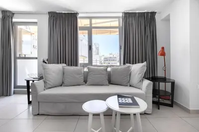 a living room with a couch and a table at Supreme D1 Penthouse 131m² in Syntagma in Athens