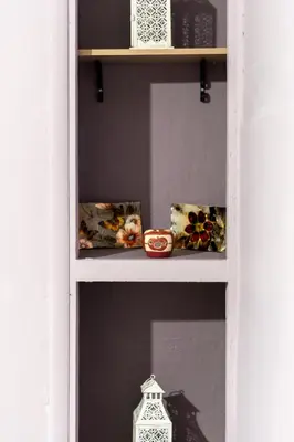 a shelf with vases and a candle on it at The Sweetest Acropolis Flat in Athens