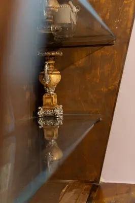 a glass shelf with a vase on a wall at The Sweetest Acropolis Flat in Athens