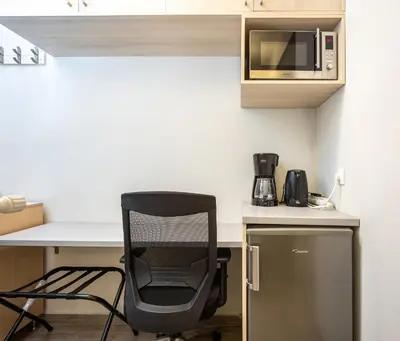 a black chair sitting at a desk in a kitchen at GK Mex in Athens