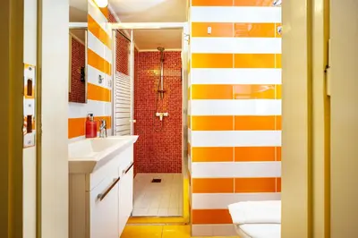 a bathroom with orange and white stripes at GK Mex in Athens