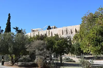 a building with a bunch of trees in front of it at Absolute Athens III in Athens