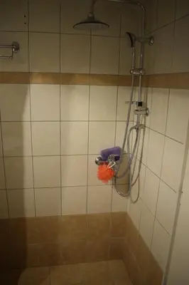 a shower in a bathroom with a glass door at Historic Center Apartment at Thisseio in Athens