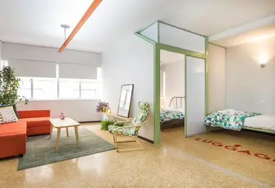 a living room with a mirror and a couch at Delfini Home Plaka/Acropolis in Athens