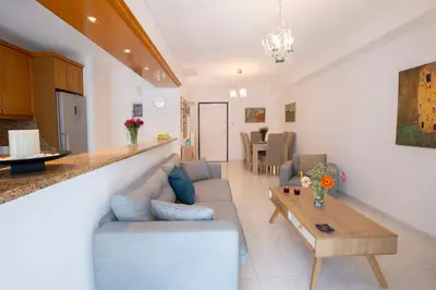 a living room with a couch and a table at Zeas Apartment in Piraeus