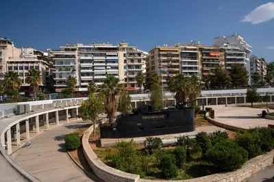 a view of a city with buildings and trees at Zeas Apartment in Piraeus
