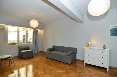 a living room with a couch and a chair at Athens' heart Syntagma metro apartment in Athens