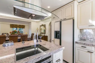 a kitchen with a sink and a refrigerator at Villa Melia Athenian Riviera in Sounio