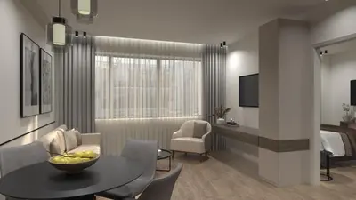 a living room with a table and a bedroom at Feel Athens Studios at Monastiraki in Athens