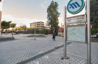 a sign on the side of a city street at Signature Athens Residence, 130 sqm, Near Metro in Athens