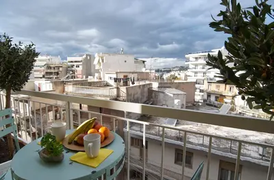 a plate of fruit on a table on a balcony at Signature Athens Residence, 130 sqm, Near Metro in Athens