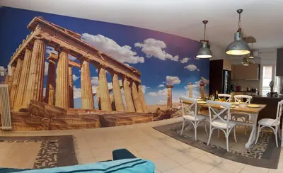 a dining room with a wall mural of the acropolis at Signature Athens Residence, 130 sqm, Near Metro in Athens