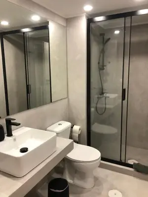 a bathroom with a toilet and a sink and a shower at Exarcheia House in Athens