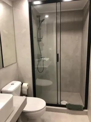 a bathroom with a shower with a toilet and a sink at Exarcheia House in Athens