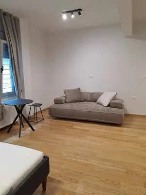 a living room with a couch and a table at Exarcheia House in Athens