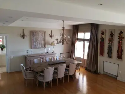 a dining room with a table and chairs at Endless Blue in Anavissos